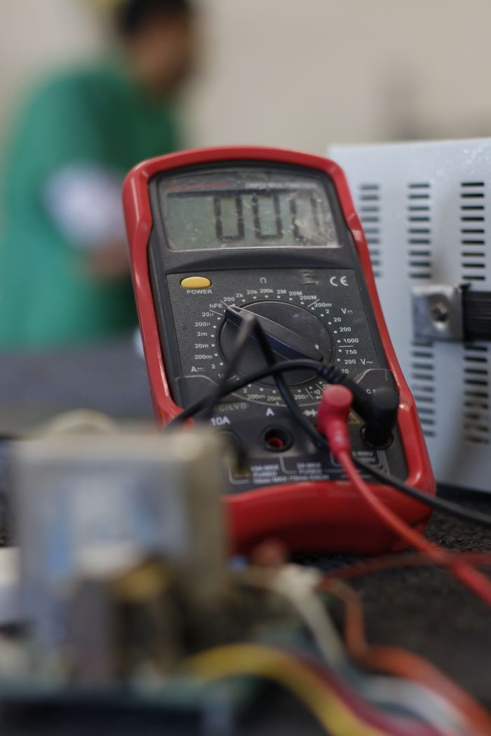 hero-img-01 Close-up shot of a multimeter used for electrical measurements, with focus on the display.